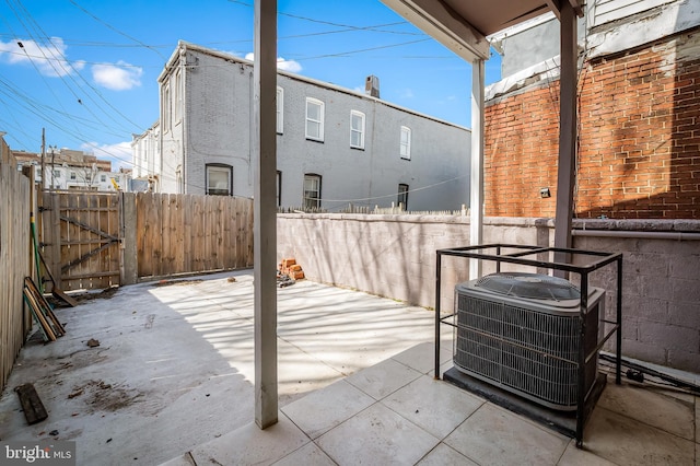 738 N Patterson Park Ave, Baltimore, MD 21205 - view of patio with fence, central AC unit, and a gate