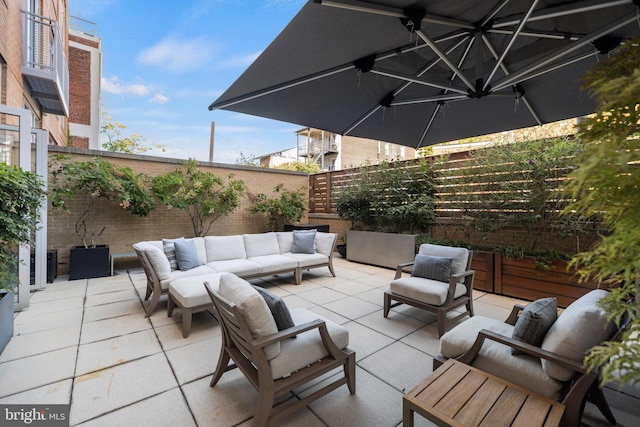 view of patio / terrace with an outdoor hangout area and a fenced backyard