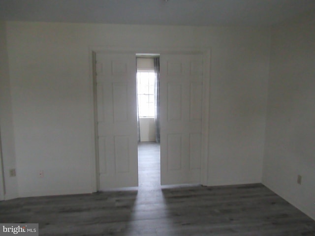 spare room with wood finished floors