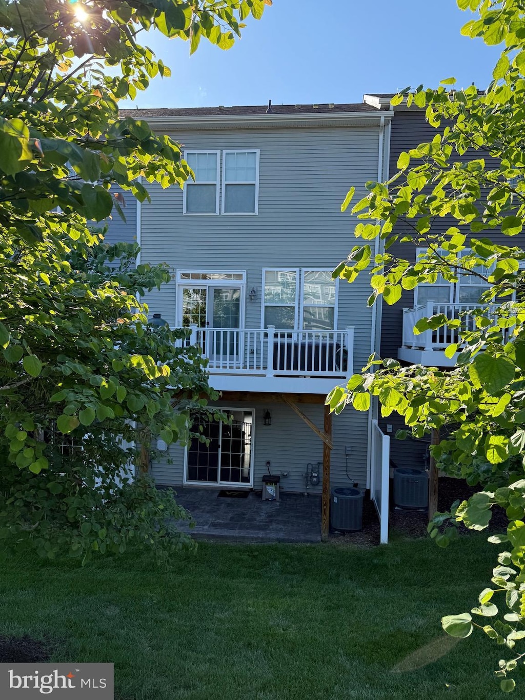 6210 Quinns Creek Dr, Haymarket, VA 20169 - back of house with a lawn, central AC, and a patio