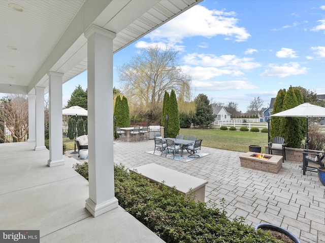 view of patio featuring outdoor dining space and an outdoor fire pit