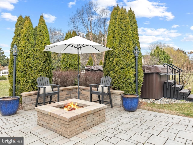 view of patio / terrace featuring a fire pit