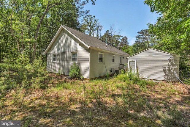 119 Rieck Ave, Millville, NJ 08332 - view of side of home with central air condition unit and an outbuilding