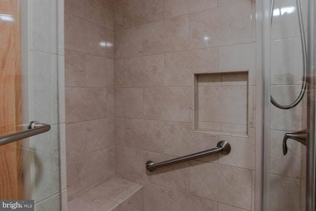 bathroom with a shower stall
