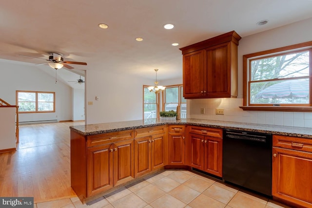 kitchen with brown cabinets, a baseboard radiator, black dishwasher, and a peninsula