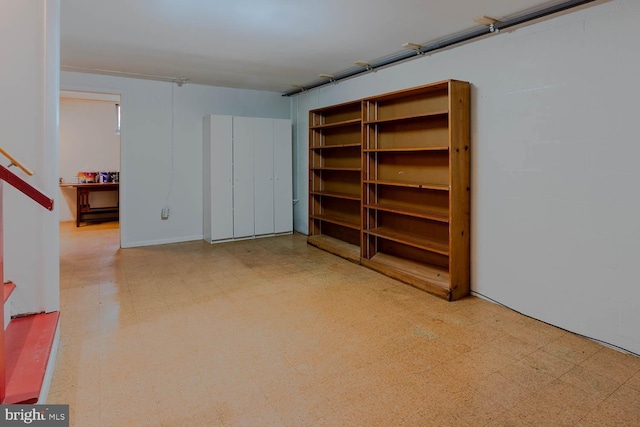 basement with tile patterned floors