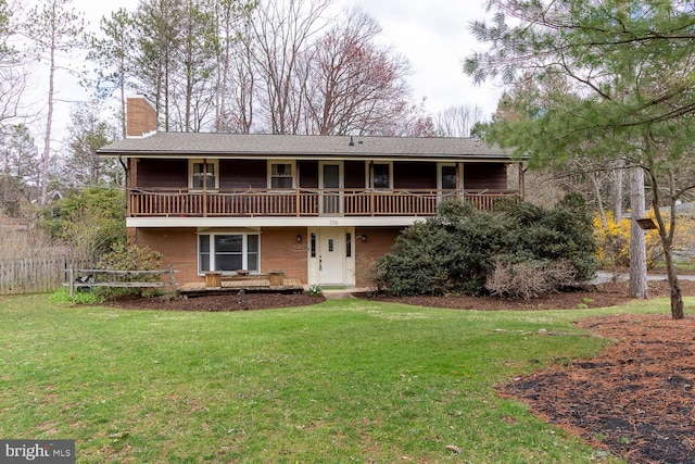 view of front facade featuring a front lawn, fence, and a chimney