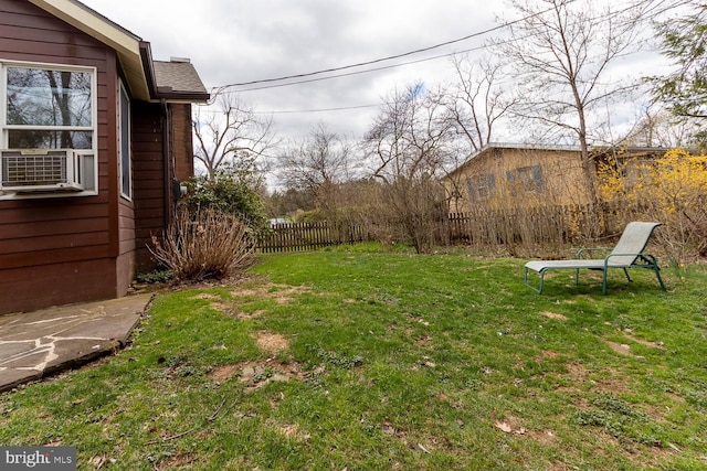 view of yard featuring fence and cooling unit