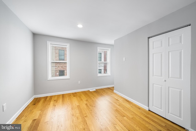 618 Mcclellan St, Philadelphia, PA 19148 - unfurnished bedroom featuring light wood-type flooring, baseboards, and a closet
