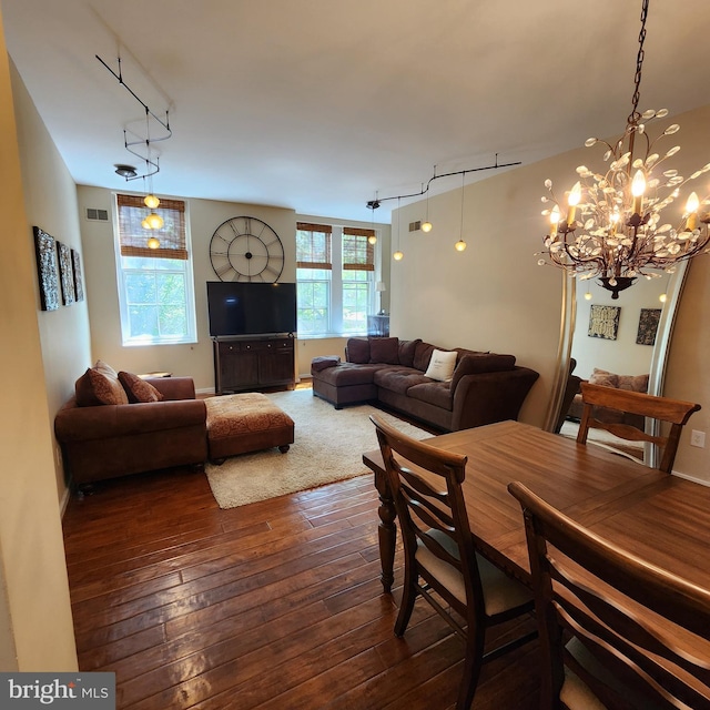 1023 Clinton St Unit 204, Philadelphia, PA 19107 - dining space featuring rail lighting, dark wood-style flooring, visible vents, and a chandelier