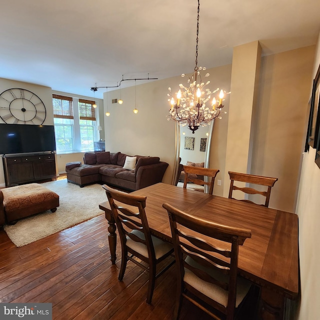 1023 Clinton St Unit 204, Philadelphia, PA 19107 - dining room featuring an inviting chandelier and dark wood-style flooring
