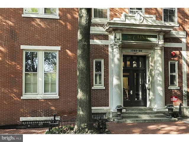 1023 Clinton St Unit 204, Philadelphia, PA 19107 - property entrance with french doors and brick siding