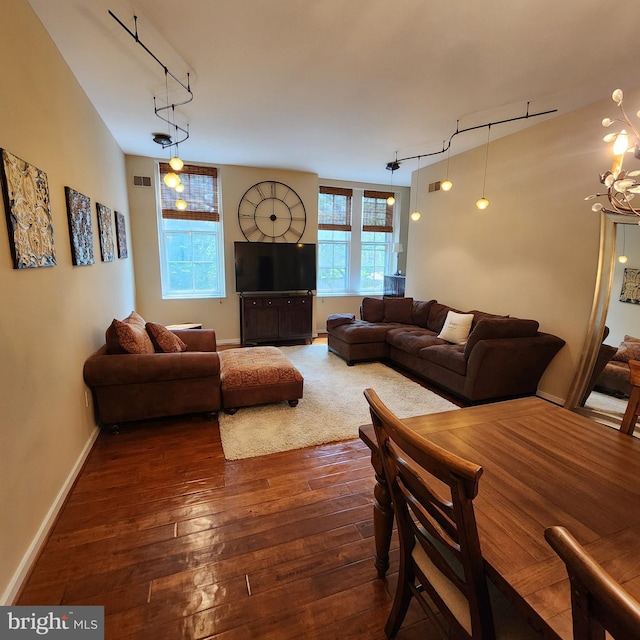 1023 Clinton St Unit 204, Philadelphia, PA 19107 - living area with track lighting, visible vents, dark wood-style flooring, and baseboards