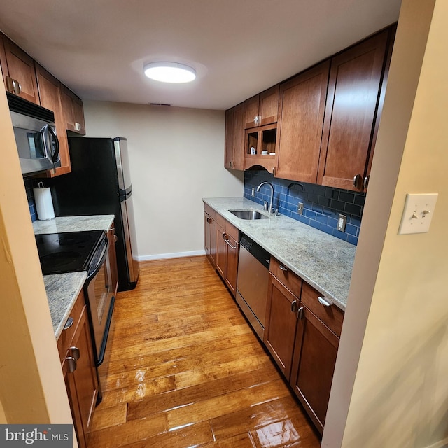 1023 Clinton St Unit 204, Philadelphia, PA 19107 - kitchen featuring a sink, range with electric cooktop, backsplash, light wood-style flooring, and stainless steel dishwasher