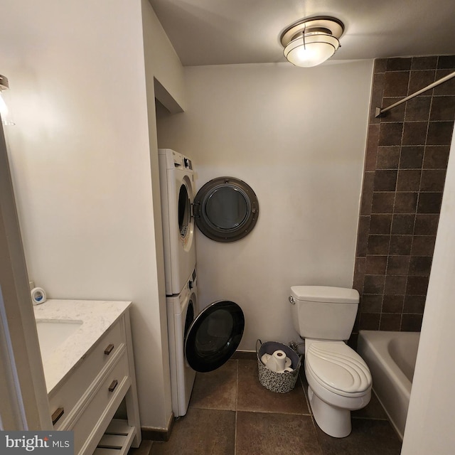 1023 Clinton St Unit 204, Philadelphia, PA 19107 - full bathroom featuring toilet, tile patterned floors, stacked washer and clothes dryer, and vanity