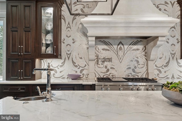 interior space with decorative backsplash and a sink