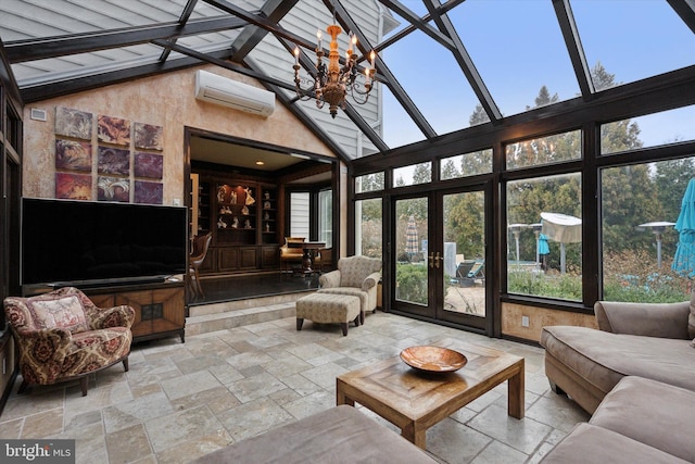 sunroom with french doors, an AC wall unit, and a notable chandelier
