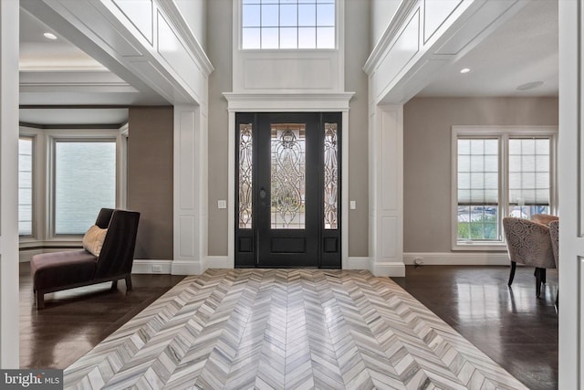 entryway featuring baseboards, recessed lighting, and dark wood-type flooring