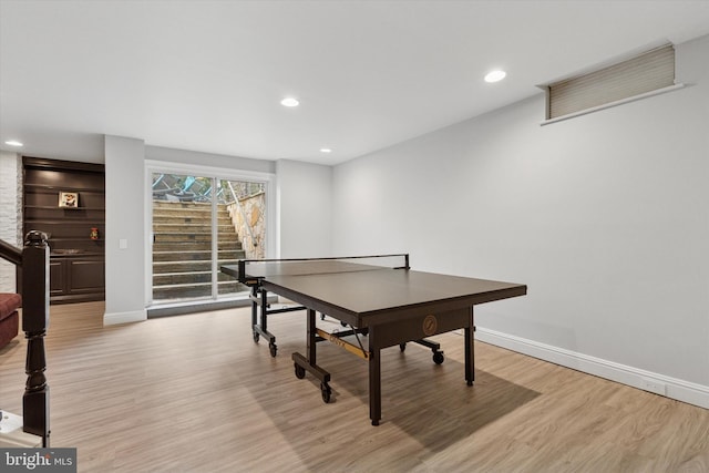 recreation room featuring light wood-style floors, recessed lighting, and baseboards