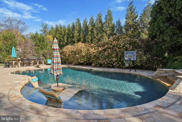 outdoor pool featuring a patio