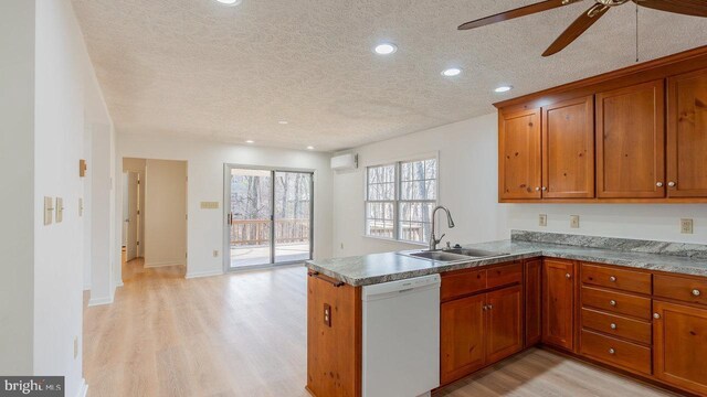 159 Yancey Ct, Mc Gaheysville, VA 22840 - kitchen with brown cabinets, dishwasher, a wall mounted air conditioner, and a sink