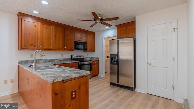 159 Yancey Ct, Mc Gaheysville, VA 22840 - kitchen with brown cabinets, a sink, stainless steel appliances, a peninsula, and ceiling fan