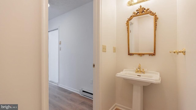 159 Yancey Ct, Mc Gaheysville, VA 22840 - bathroom featuring a baseboard radiator, baseboards, a textured ceiling, and wood finished floors