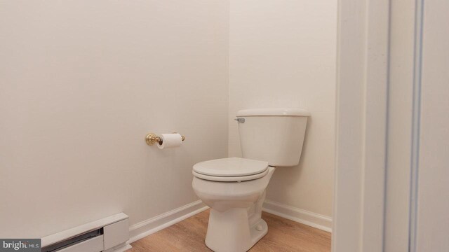 159 Yancey Ct, Mc Gaheysville, VA 22840 - bathroom featuring toilet, a baseboard heating unit, baseboards, and wood finished floors