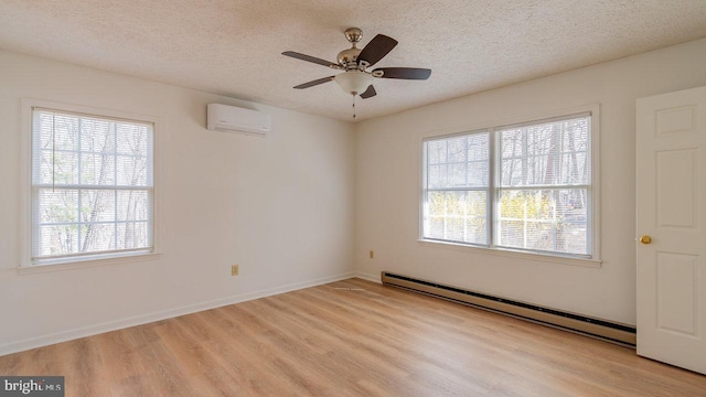 159 Yancey Ct, Mc Gaheysville, VA 22840 - spare room with a wealth of natural light, a wall mounted air conditioner, light wood-style flooring, and baseboard heating