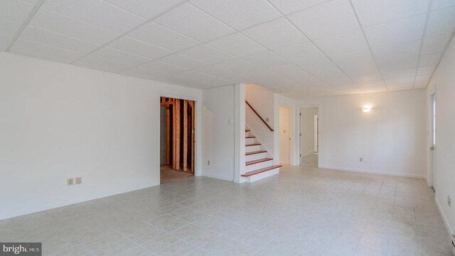 159 Yancey Ct, Mc Gaheysville, VA 22840 - empty room featuring baseboards, a paneled ceiling, and stairs