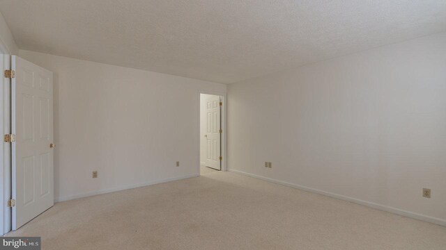159 Yancey Ct, Mc Gaheysville, VA 22840 - unfurnished room featuring baseboards, light colored carpet, and a textured ceiling