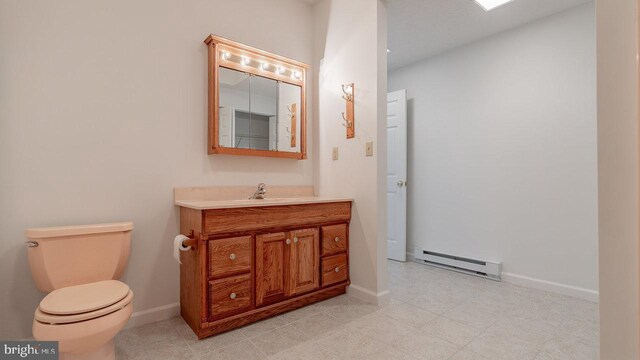 159 Yancey Ct, Mc Gaheysville, VA 22840 - half bathroom featuring vanity, toilet, a baseboard heating unit, and baseboards