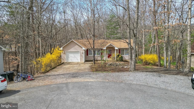 159 Yancey Ct, Mc Gaheysville, VA 22840 - ranch-style house featuring driveway, an attached garage, and a forest view