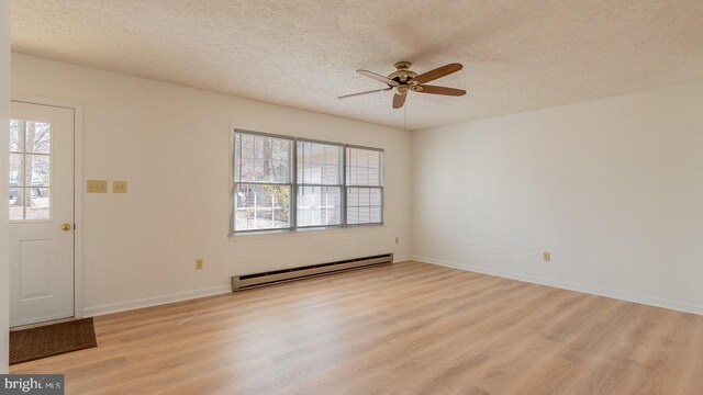 159 Yancey Ct, Mc Gaheysville, VA 22840 - foyer with a wealth of natural light, a baseboard radiator, a ceiling fan, and light wood finished floors