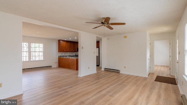 159 Yancey Ct, Mc Gaheysville, VA 22840 - unfurnished living room with ceiling fan, a textured ceiling, light wood finished floors, and a baseboard radiator