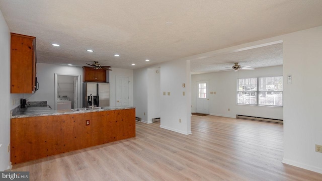 159 Yancey Ct, Mc Gaheysville, VA 22840 - kitchen with a peninsula, stainless steel fridge, baseboard heating, and ceiling fan