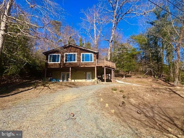chalet / cabin featuring a wooden deck and french doors