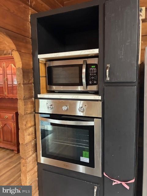 room details with light wood finished floors and stainless steel appliances