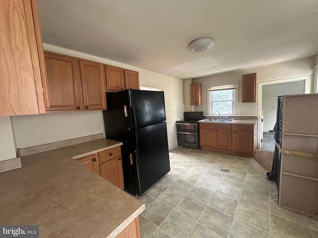 17702 Lappans, Saint James, MD 21781 - kitchen featuring freestanding refrigerator, double oven range, a sink, and brown cabinets