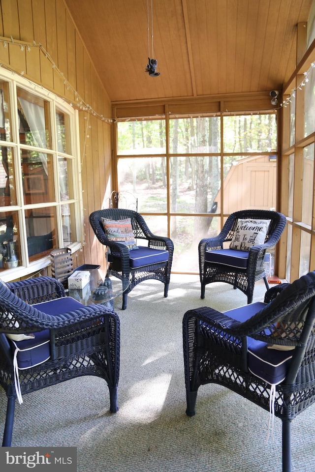sunroom / solarium with wood ceiling and lofted ceiling