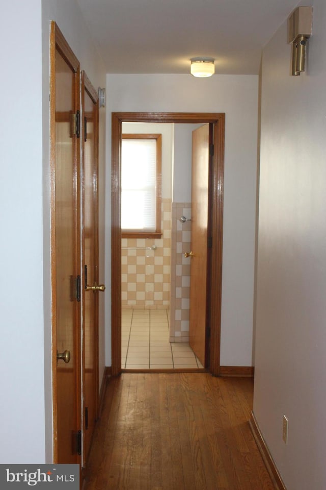hall with wood finished floors