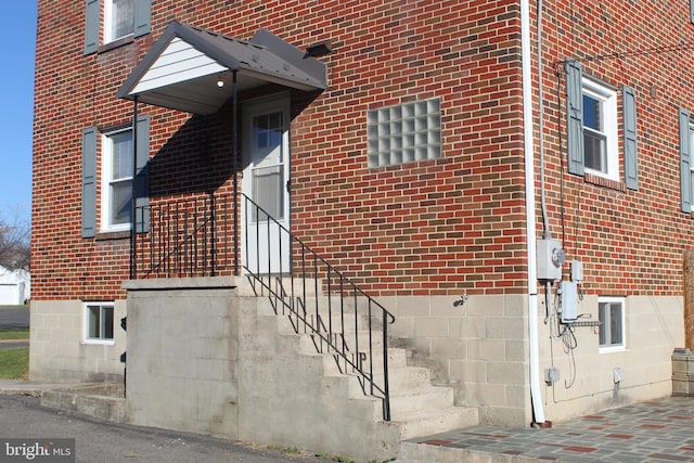 entrance to property with brick siding