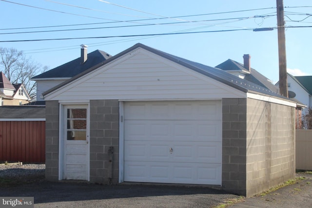 garage with fence