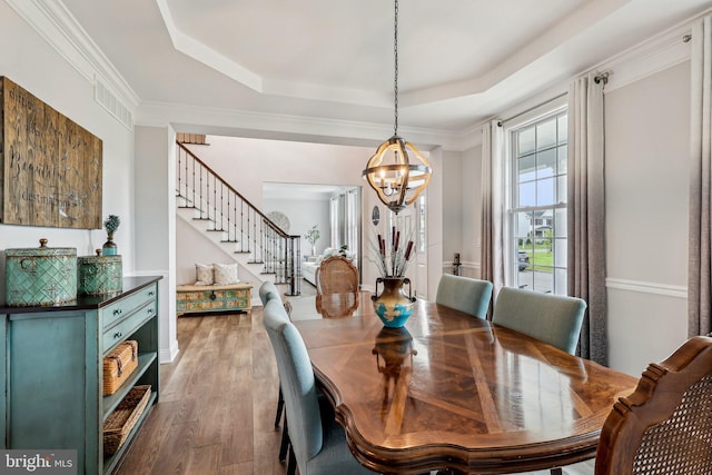 52 Olivia Way, Chesterfield, NJ 08515 - dining space with a chandelier, a raised ceiling, stairs, and wood finished floors