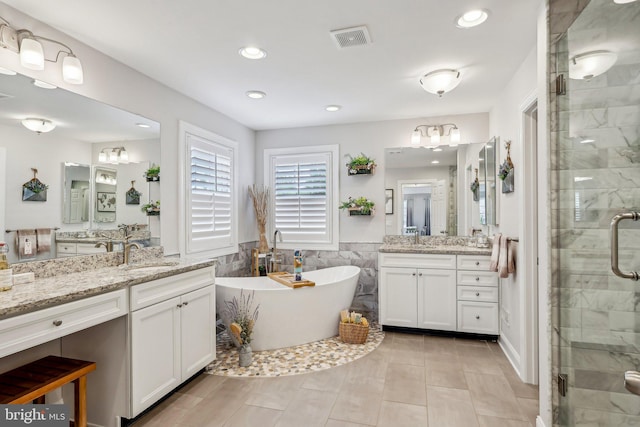52 Olivia Way, Chesterfield, NJ 08515 - full bath featuring a stall shower, a freestanding bath, two vanities, tile walls, and recessed lighting
