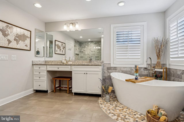 52 Olivia Way, Chesterfield, NJ 08515 - full bathroom with vanity, a stall shower, a freestanding bath, recessed lighting, and tile walls