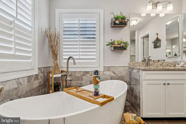52 Olivia Way, Chesterfield, NJ 08515 - full bath with tile walls, vanity, a freestanding bath, and a wainscoted wall