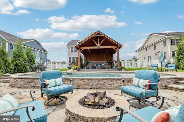 52 Olivia Way, Chesterfield, NJ 08515 - fenced backyard with a hot tub, a fire pit, a patio area, and a gazebo