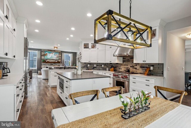 52 Olivia Way, Chesterfield, NJ 08515 - kitchen featuring designer stove, range hood, backsplash, recessed lighting, and a kitchen island