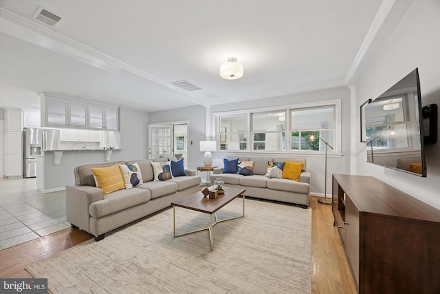 1220 Wendover Rd, Bryn Mawr, PA 19010 - living room featuring crown molding, light wood finished floors, baseboards, and visible vents